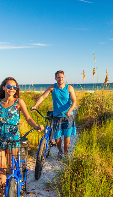 Fiets door de uitgestrekte duinen en sfeervolle kustplaatsen